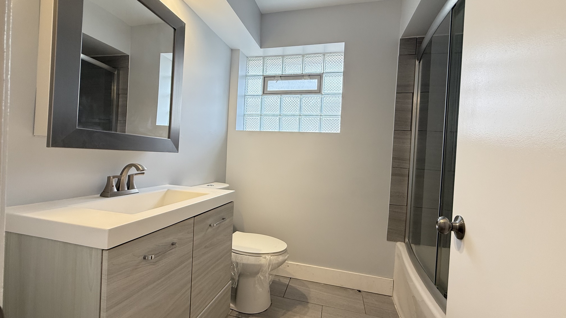 1345 North Latrobe Avenue Chicago, IL 60651 - Photo 33 of 50 a bathroom with a sink and a mirror