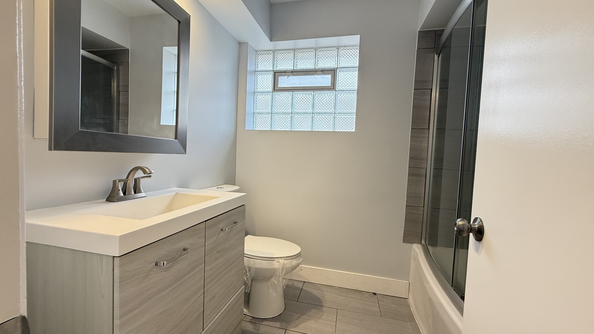 1345 North Latrobe Avenue Chicago, IL 60651 - Photo 34 of 50 a bathroom with a sink toilet and vanity