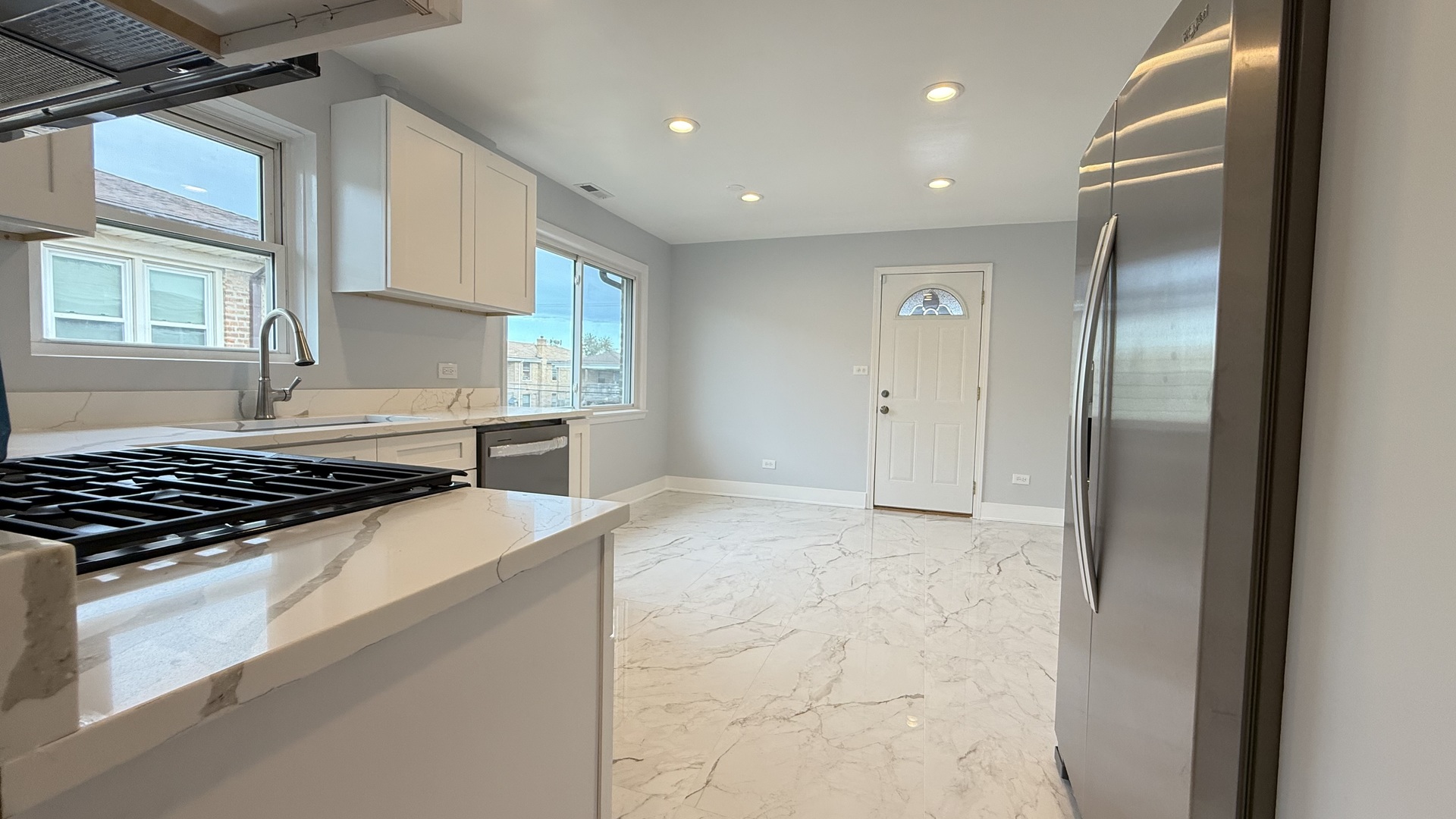 1345 North Latrobe Avenue Chicago, IL 60651 - Photo 35 of 50 a kitchen with stainless steel appliances granite countertop a refrigerator and a stove
