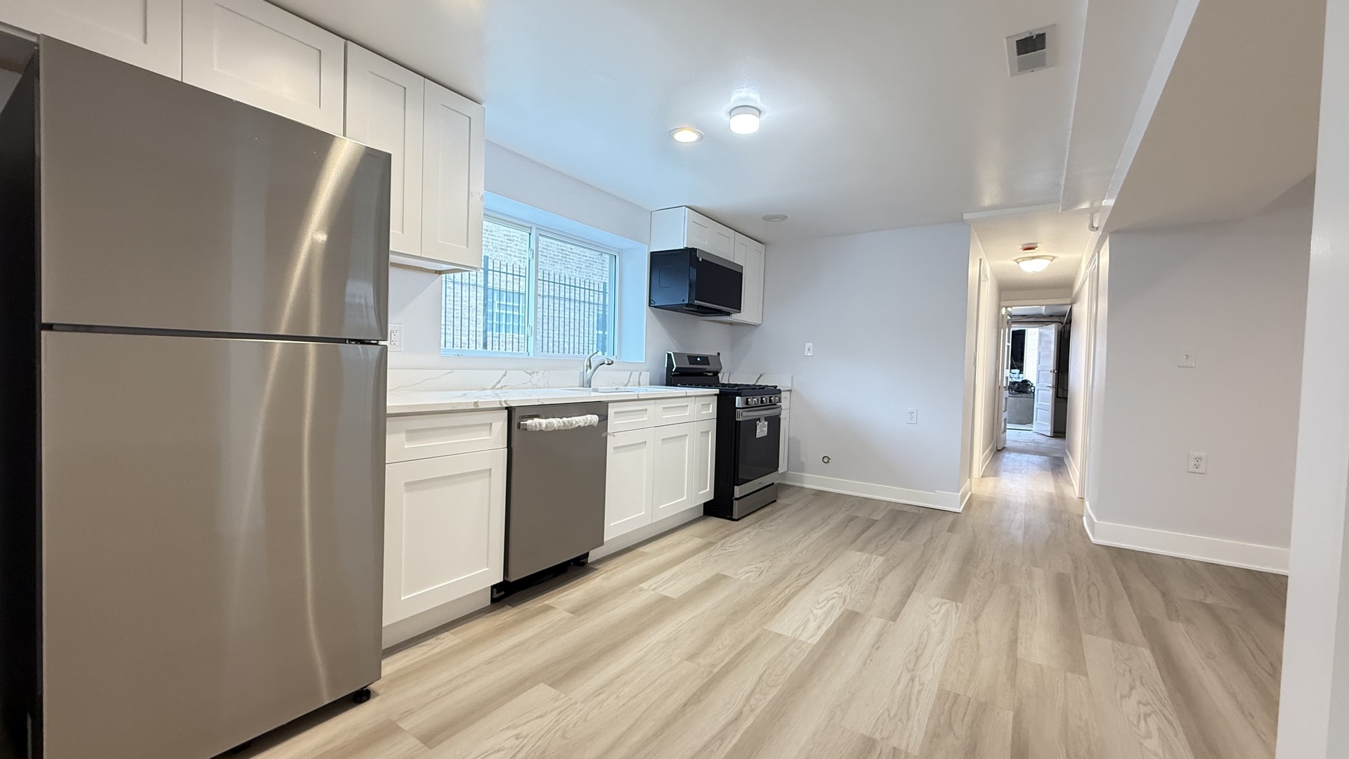 1345 North Latrobe Avenue Chicago, IL 60651 - Photo 42 of 50 a kitchen with a refrigerator a sink and dishwasher