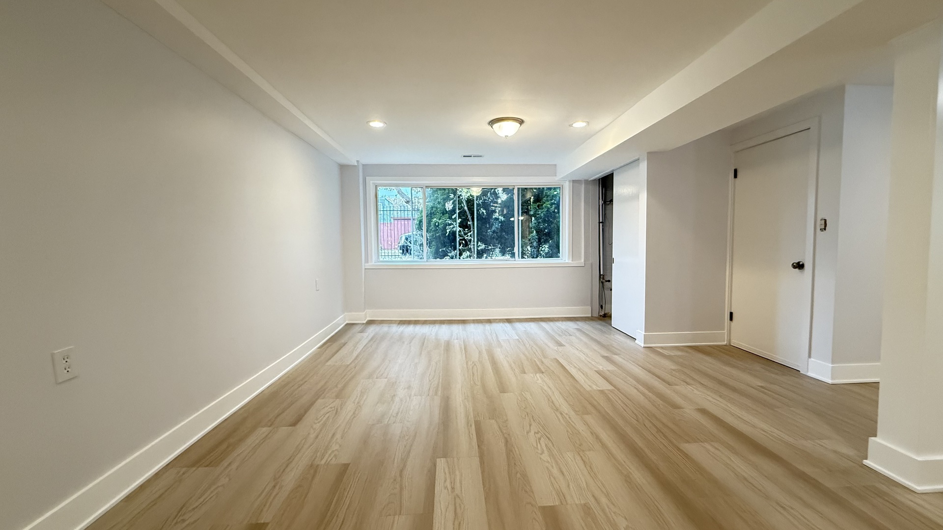 1345 North Latrobe Avenue Chicago, IL 60651 - Photo 46 of 50 an empty room with wooden floor and windows
