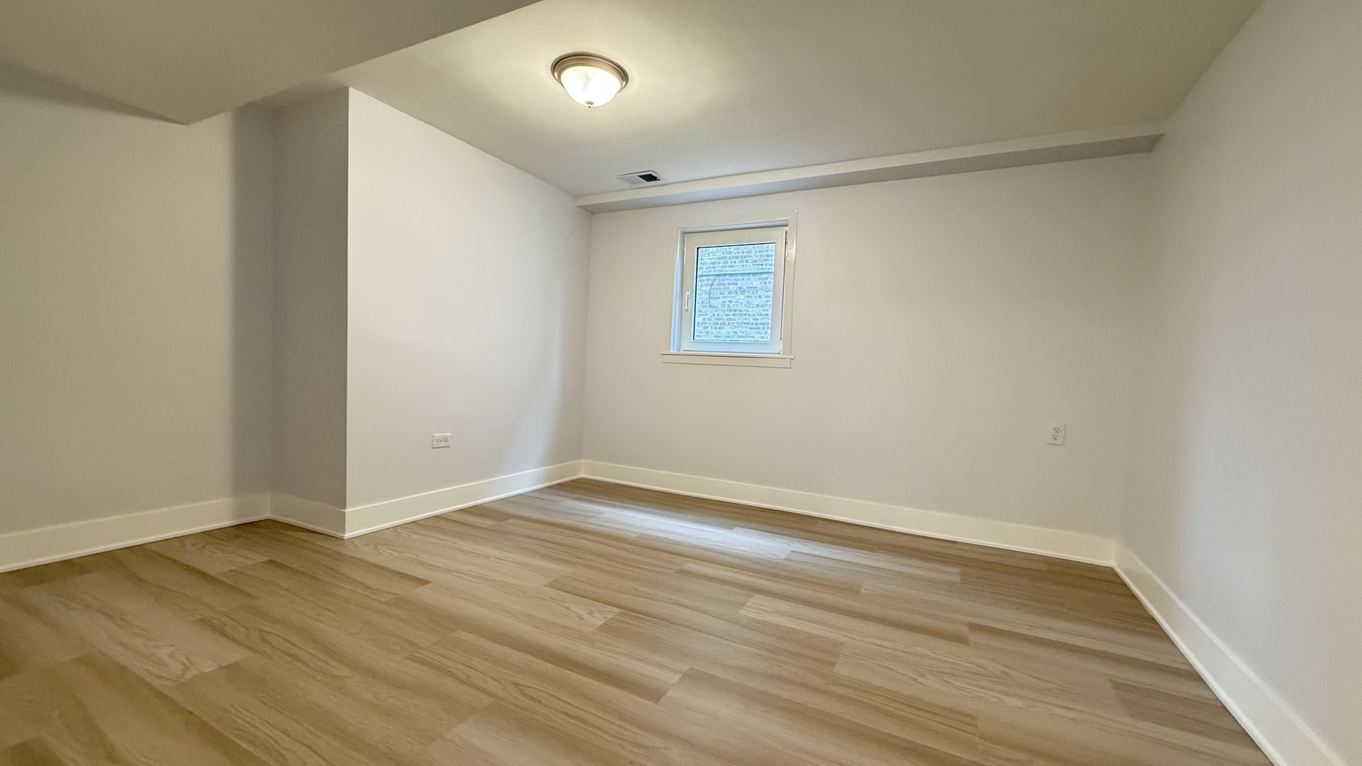 1345 North Latrobe Avenue Chicago, IL 60651 - Photo 49 of 50 wooden floor in an empty room