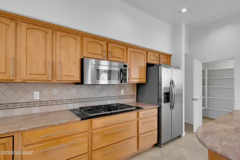 a kitchen with a sink stove and microwave