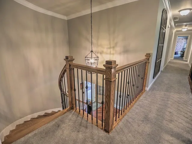a bathroom with a sink a mirror and next to a window
