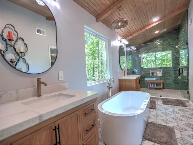 a living room with furniture ceiling fan and a window