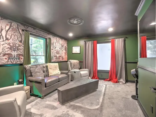 a view of a room with furniture and wooden floor