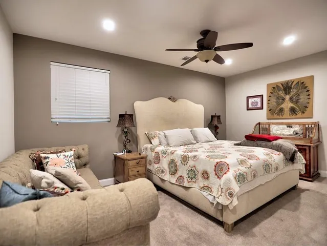 a view of a balcony with furniture and wooden floor