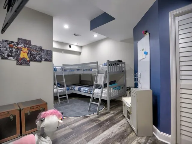 a view of roof deck with wooden floor and outdoor seating