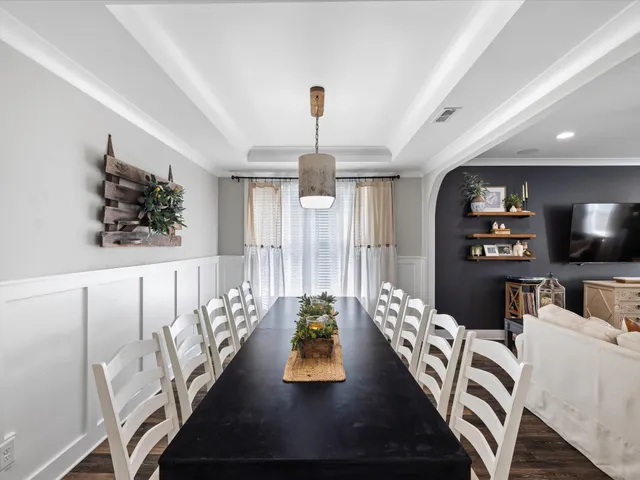 a bedroom with a bed and a night stand