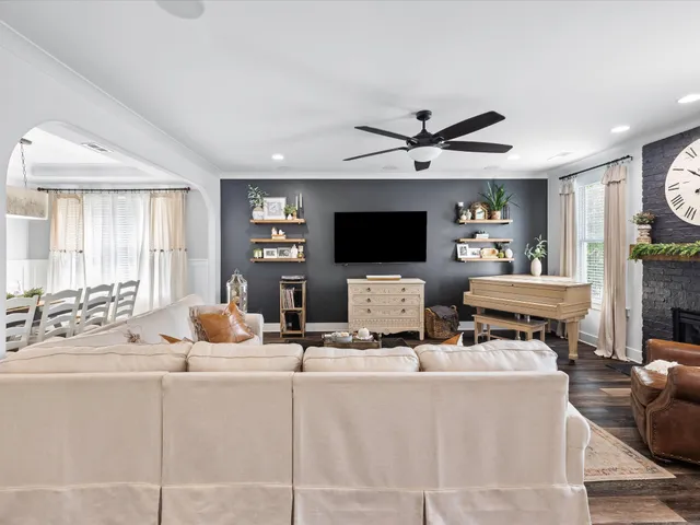 a spacious bathroom with a double vanity sink a mirror and a bathtub