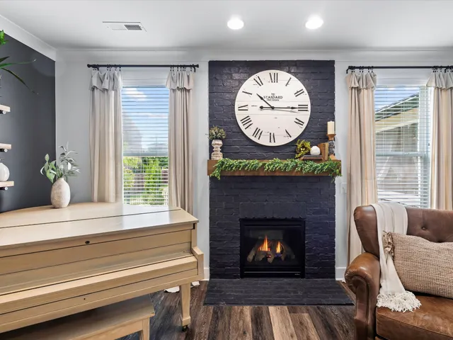 a room with furniture a air conditioner and a window