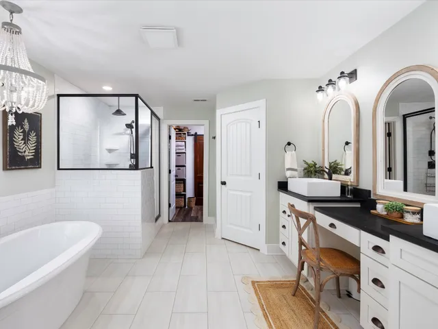 a utility room with cabinets washer and dryer