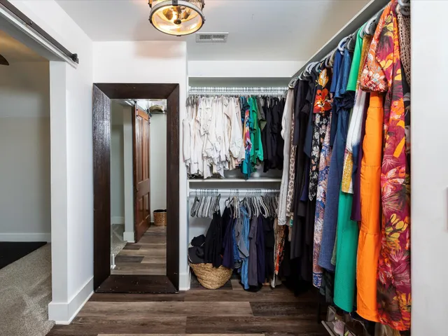 an aerial view of multiple houses with yard