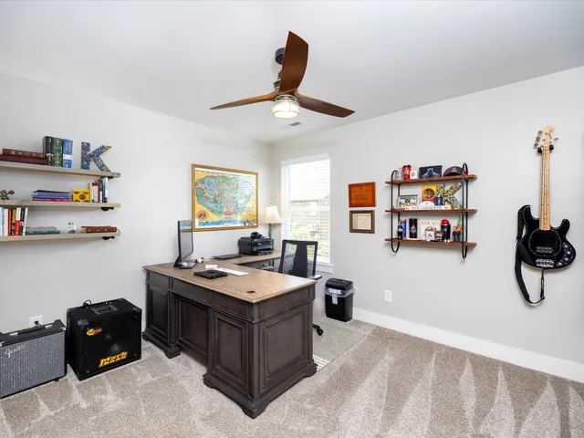a view of a house with a yard and garage