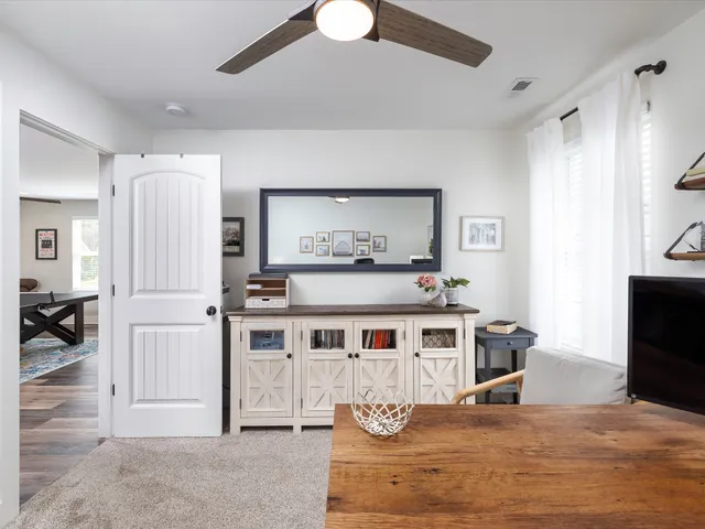 a aerial view of a house with roof deck front of house
