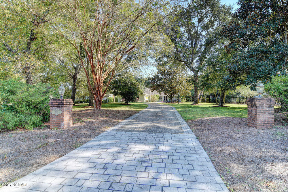 352 Olde Point Loop Hampstead, NC 28443 - Photo 4 of 59 Lovely setback from the road, beautiful established landscaping