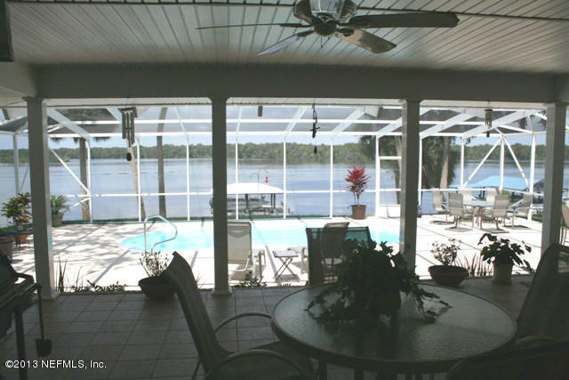 105 Riverside Way San Mateo, FL 32187 - Photo 6 of 22 Covered Lanai and Pool from Great Room