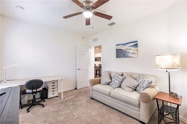 a bathroom with a granite countertop toilet sink and mirror