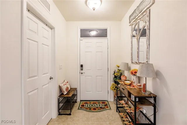 a view of a hallway with paintings on the wall