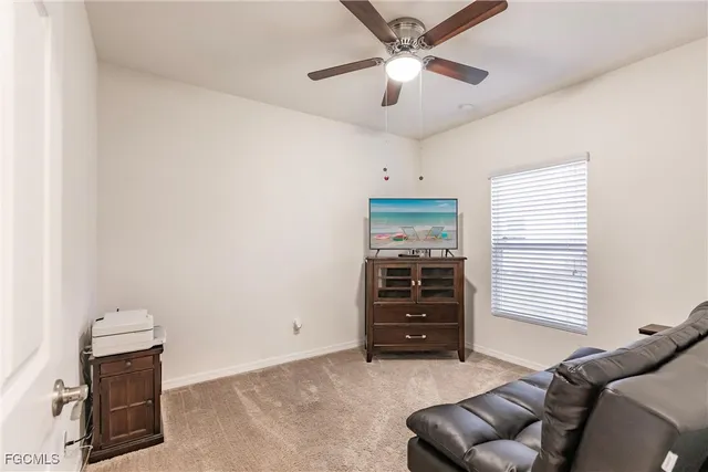 a kitchen with cabinets and chairs