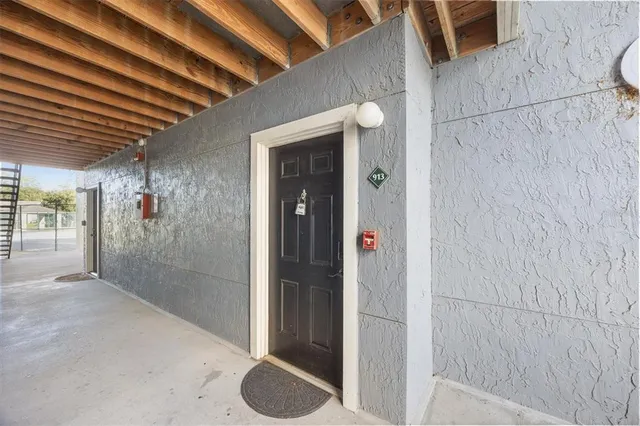 a bathroom with a shower and a sink