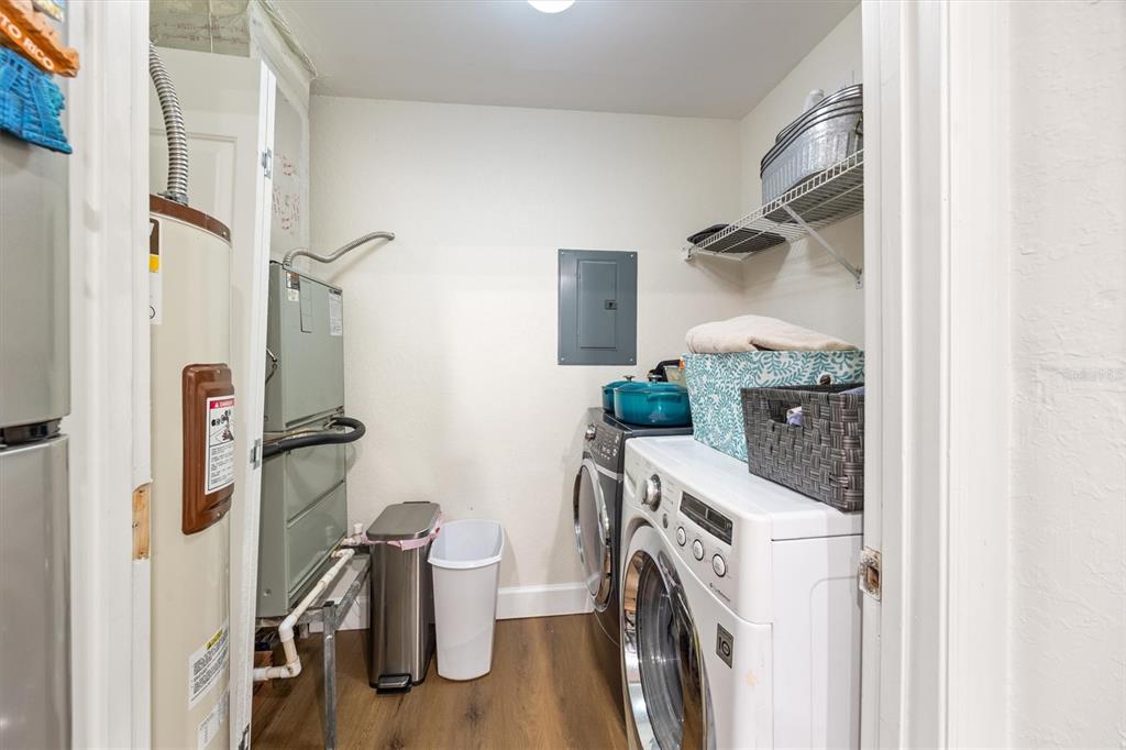 3705 Southwest 27th Street, Unit 913 Gainesville, FL 32608 - Photo 16 of 50 a storage room with washer and dryer