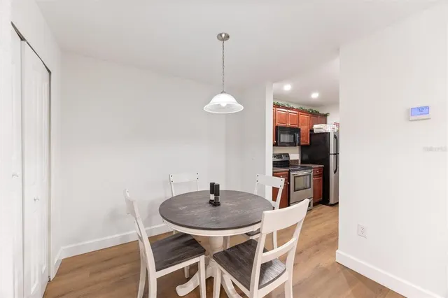 a kitchen with a table and chairs in it