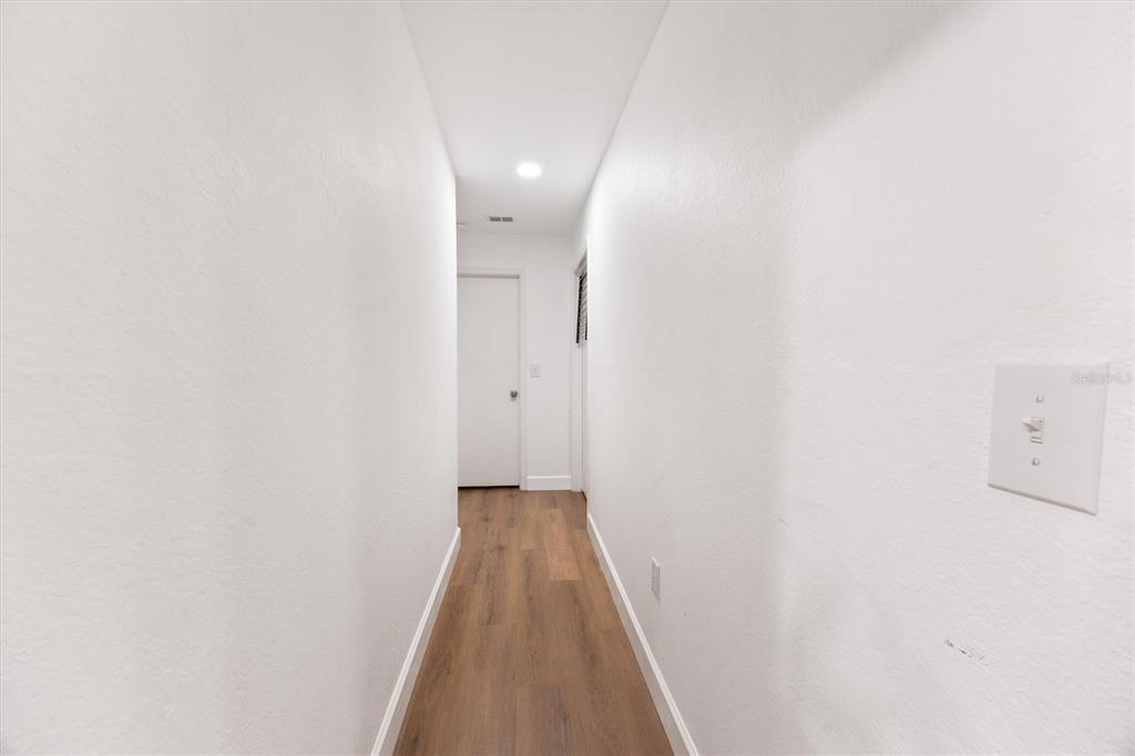 3705 Southwest 27th Street, Unit 913 Gainesville, FL 32608 - Photo 31 of 50 a view of a hallway with wooden floor
