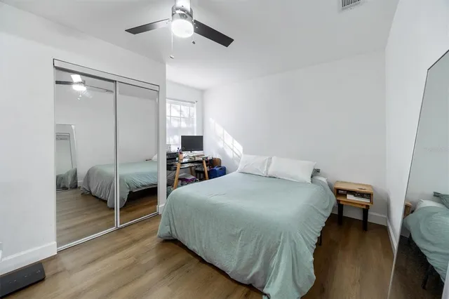 a bedroom with a bed and a table