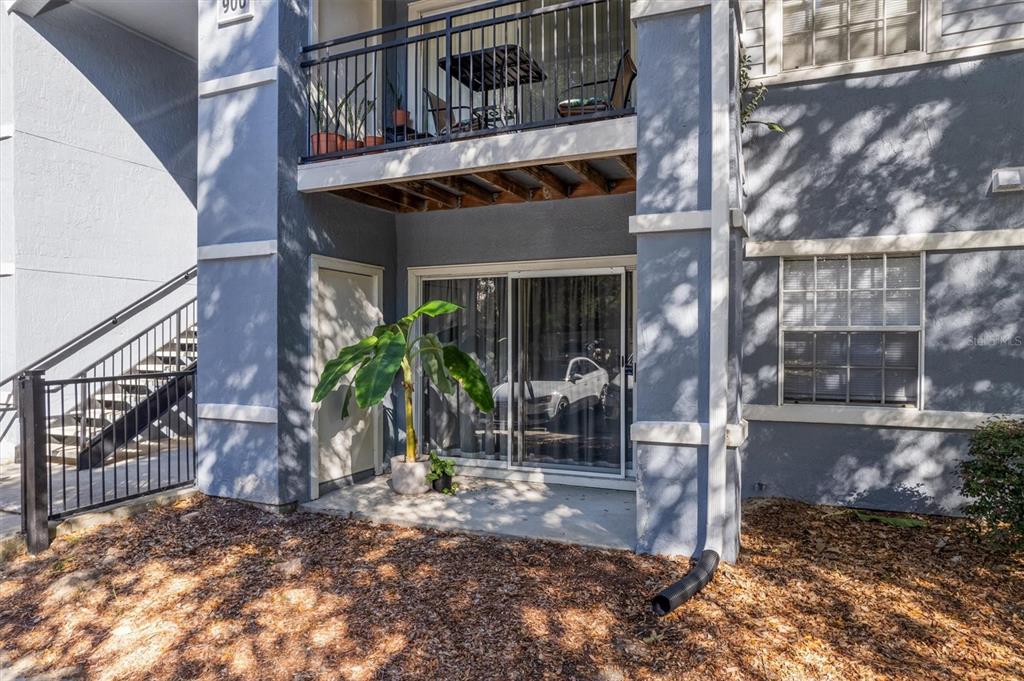 3705 Southwest 27th Street, Unit 913 Gainesville, FL 32608 - Photo 47 of 50 a view of a house with a small yard and wooden floor and fence