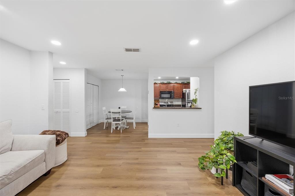 3705 Southwest 27th Street, Unit 913 Gainesville, FL 32608 - Photo 6 of 50 a living room with furniture and a flat screen tv