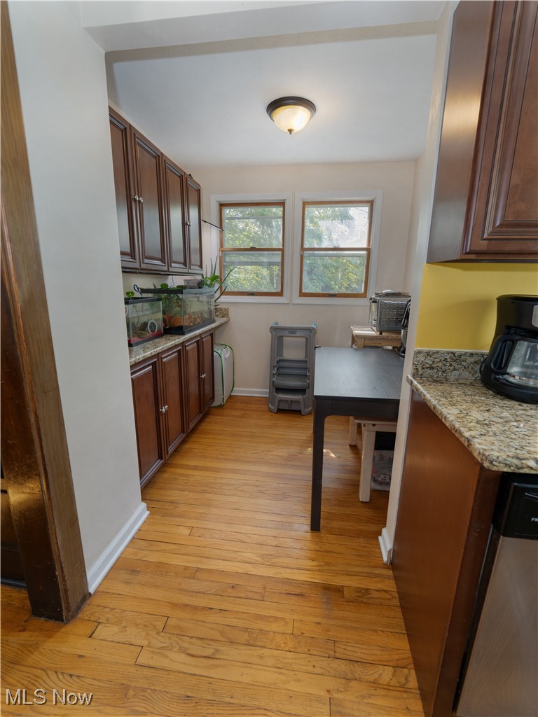 6021 Snow Road Parma, OH 44129 - Photo 9 of 28 Breakfast Nook with wood flooring and beautiful cabinetry