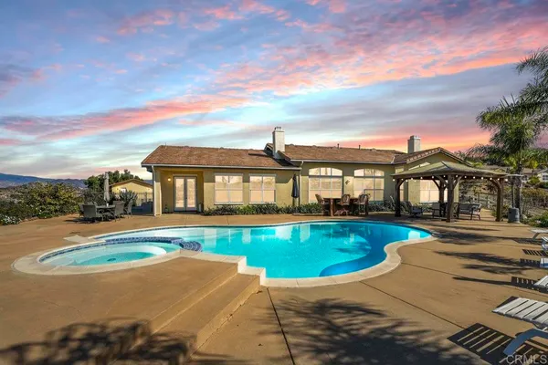a view of a swimming pool with a lounge chairs