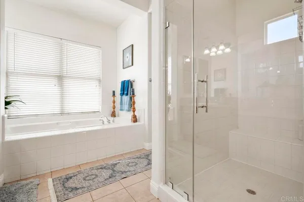 a bath tub sitting in a bathroom next to a window