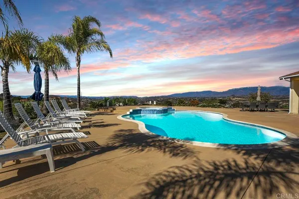 a view of a swimming pool with a lake view