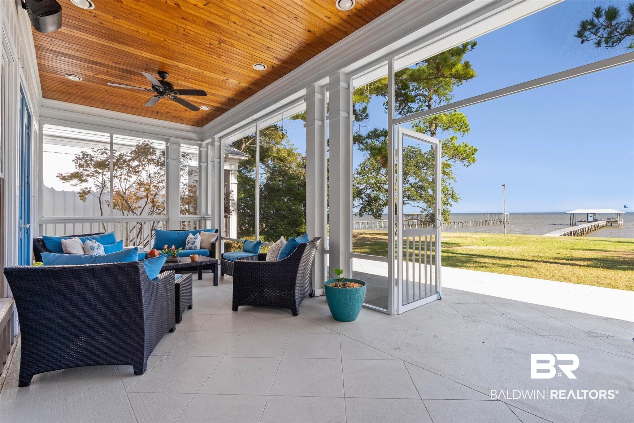 7015 Bay Road Mobile, AL 36605 - Photo 30 of 53 screened in porch a water view, a ceiling fan, and plenty of natural light