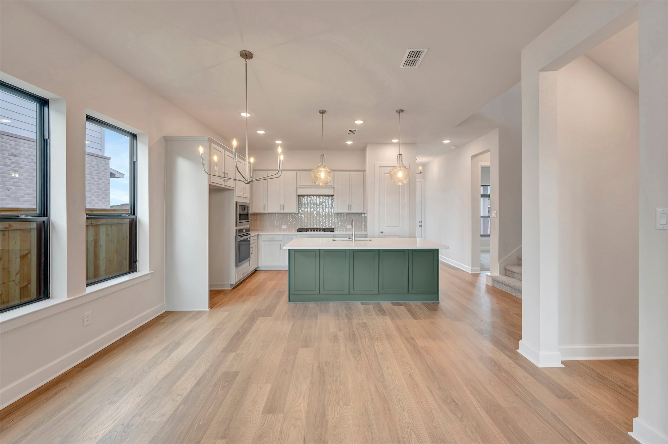 2718 Cottage Place Rosharon, TX 77583 - Photo 25 of 50 a kitchen with kitchen island wooden floors appliances and cabinets