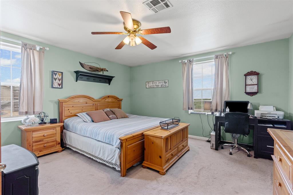 14522 Southwest County Road 4140 Dawson, TX 76639 - Photo 17 of 40 a bedroom with a bed and a window