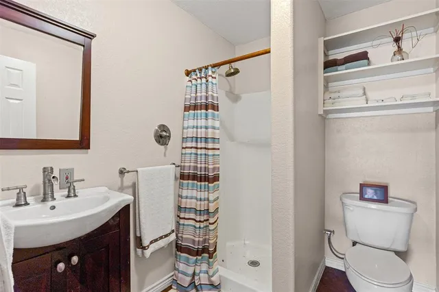 a bathroom with a bathtub and shower