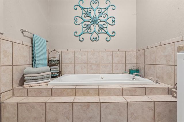 a bathroom with a sink toilet and a mirror