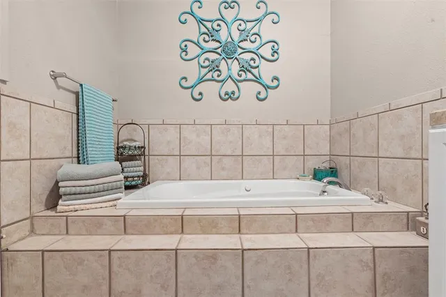 a bathroom with a sink toilet and a mirror