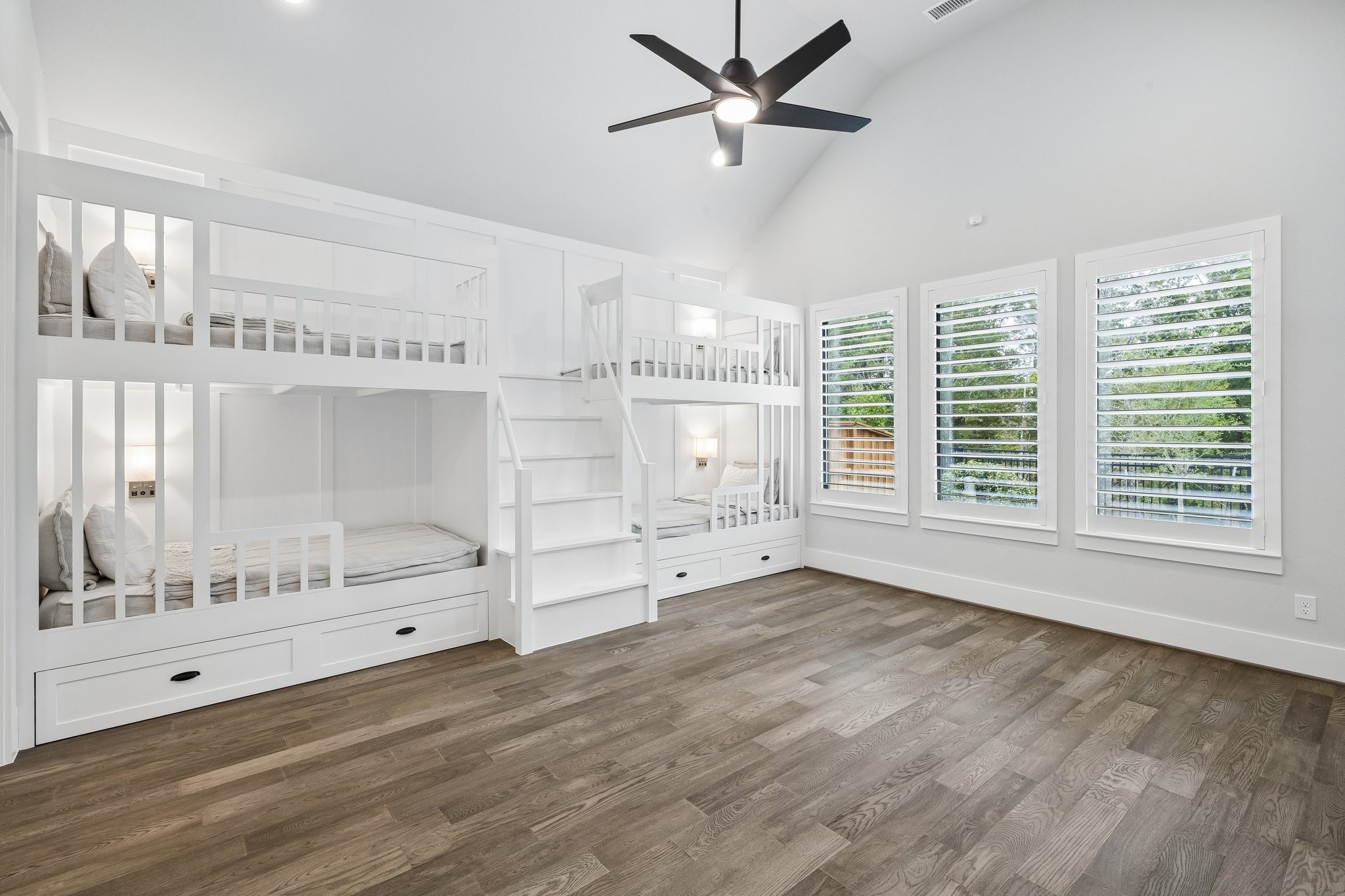 27720 Hazelbrook Lane Spring, TX 77386 - Photo 22 of 49 Your massive Gameroom features professionally designed bunk beds. Notice the added sconces, upgraded ceiling fan, recessed lighting, plantation shutters & stunning view of mature trees. Plenty of room for additional seating/gaming in this room.