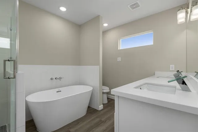 a bathroom with a sink and a bathtub