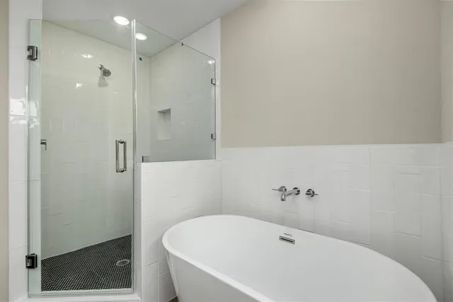 a white bath tub sitting in a bathroom