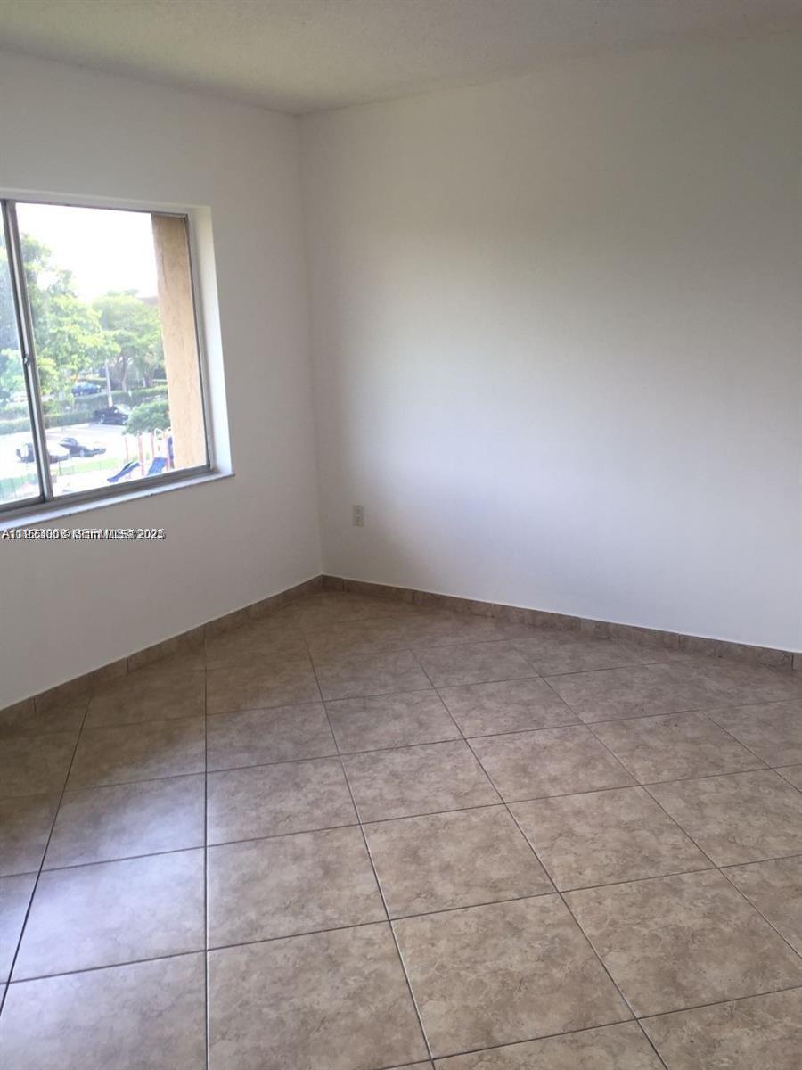 721 North Pine Island Road, Unit 416 Plantation, FL 33324 - Photo 5 of 13 a view of an empty room and window