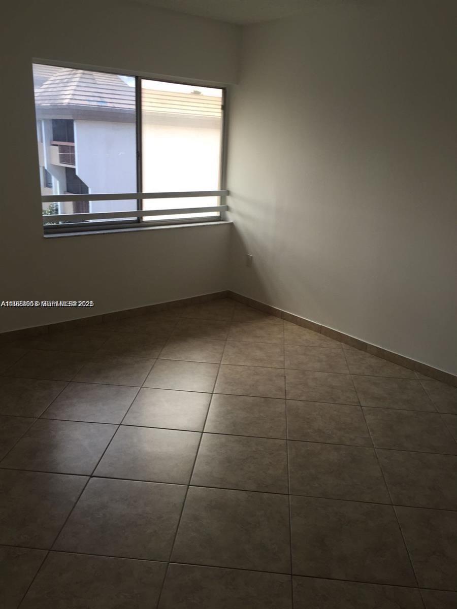 721 North Pine Island Road, Unit 416 Plantation, FL 33324 - Photo 6 of 13 a view of an empty room with a window