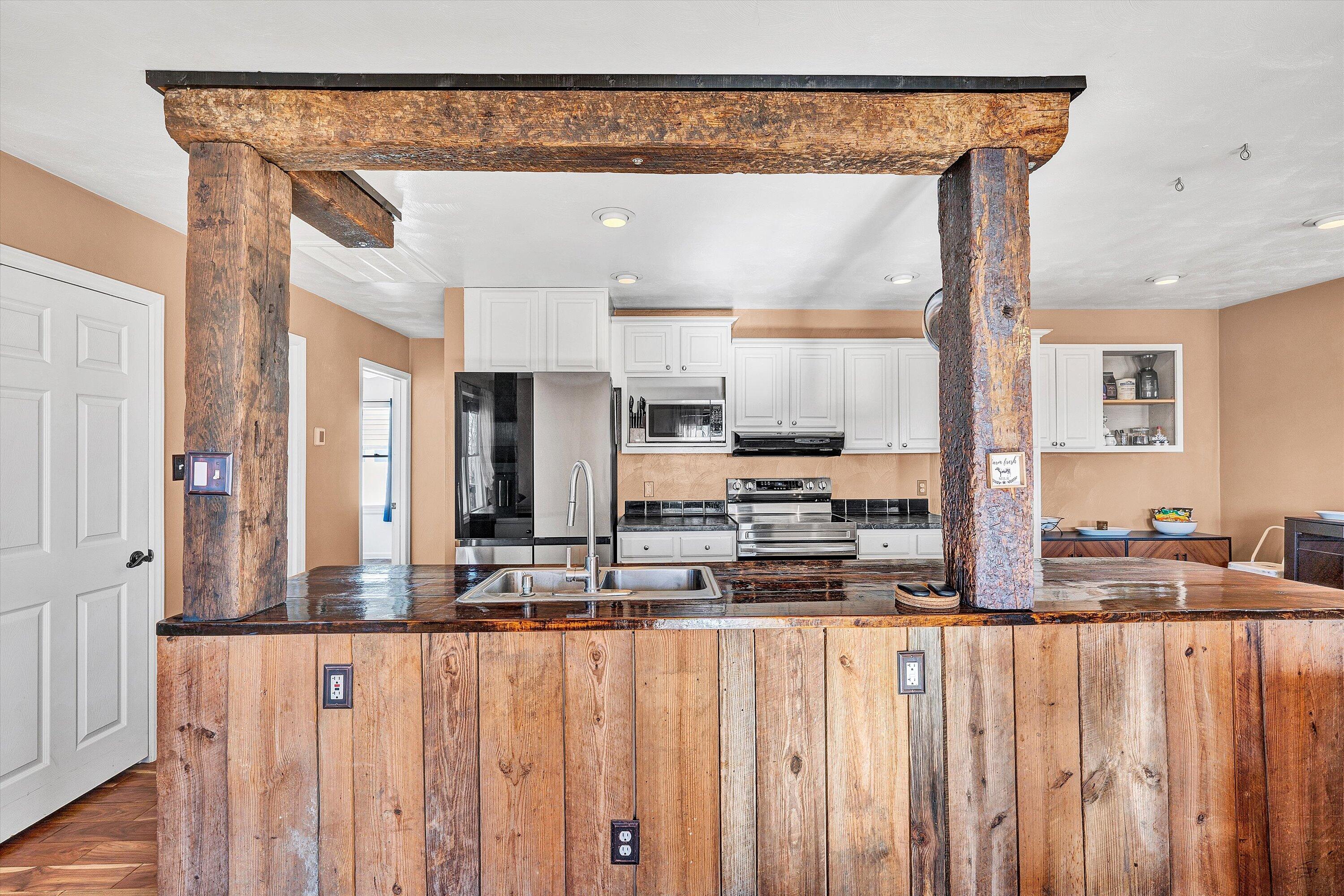 1311 Walnut Shell Drive Vinton, VA 24179 - Photo 22 of 61 a kitchen with stainless steel appliances a refrigerator and wooden cabinets