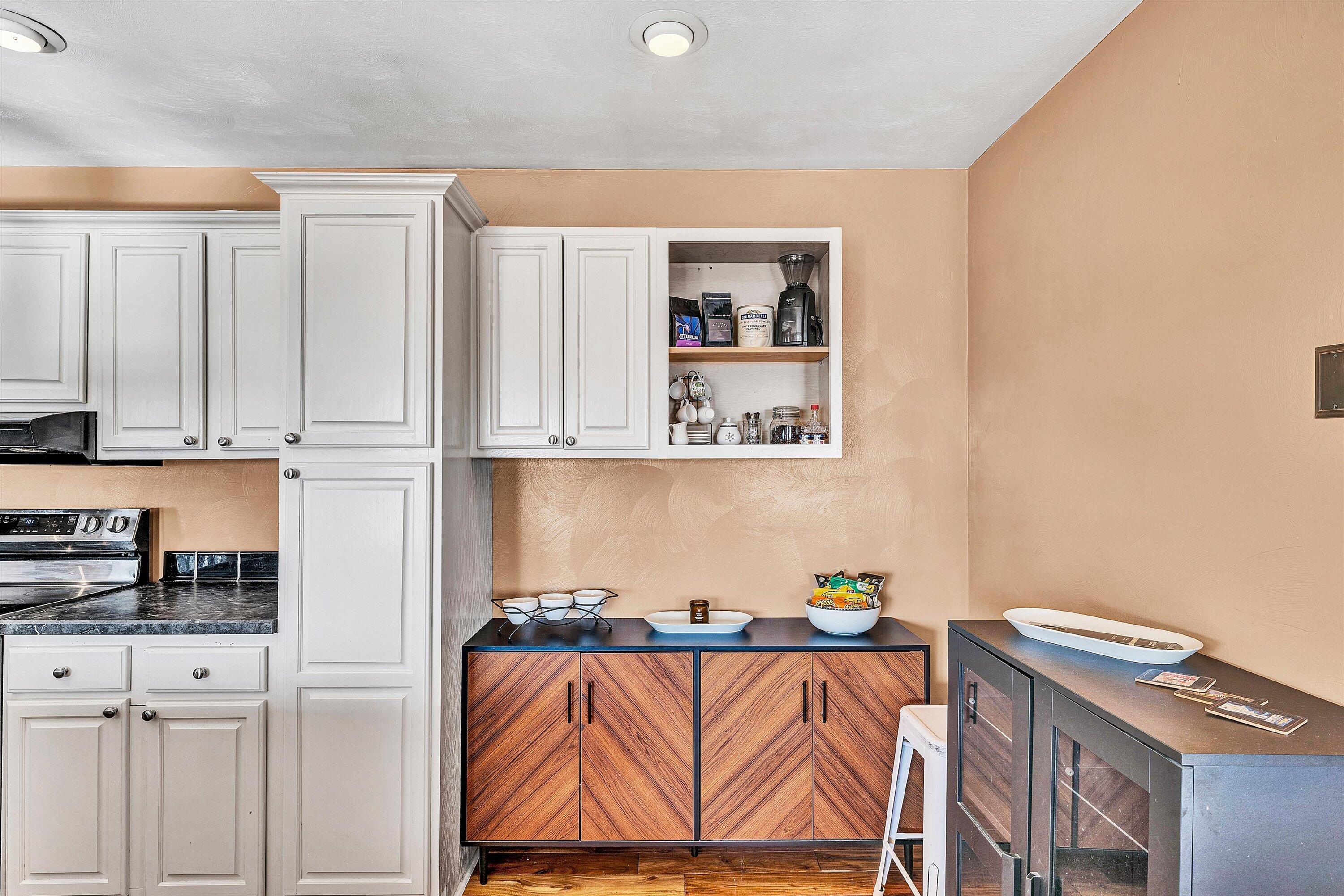 1311 Walnut Shell Drive Vinton, VA 24179 - Photo 23 of 61 a living room with white cabinets and wooden floor