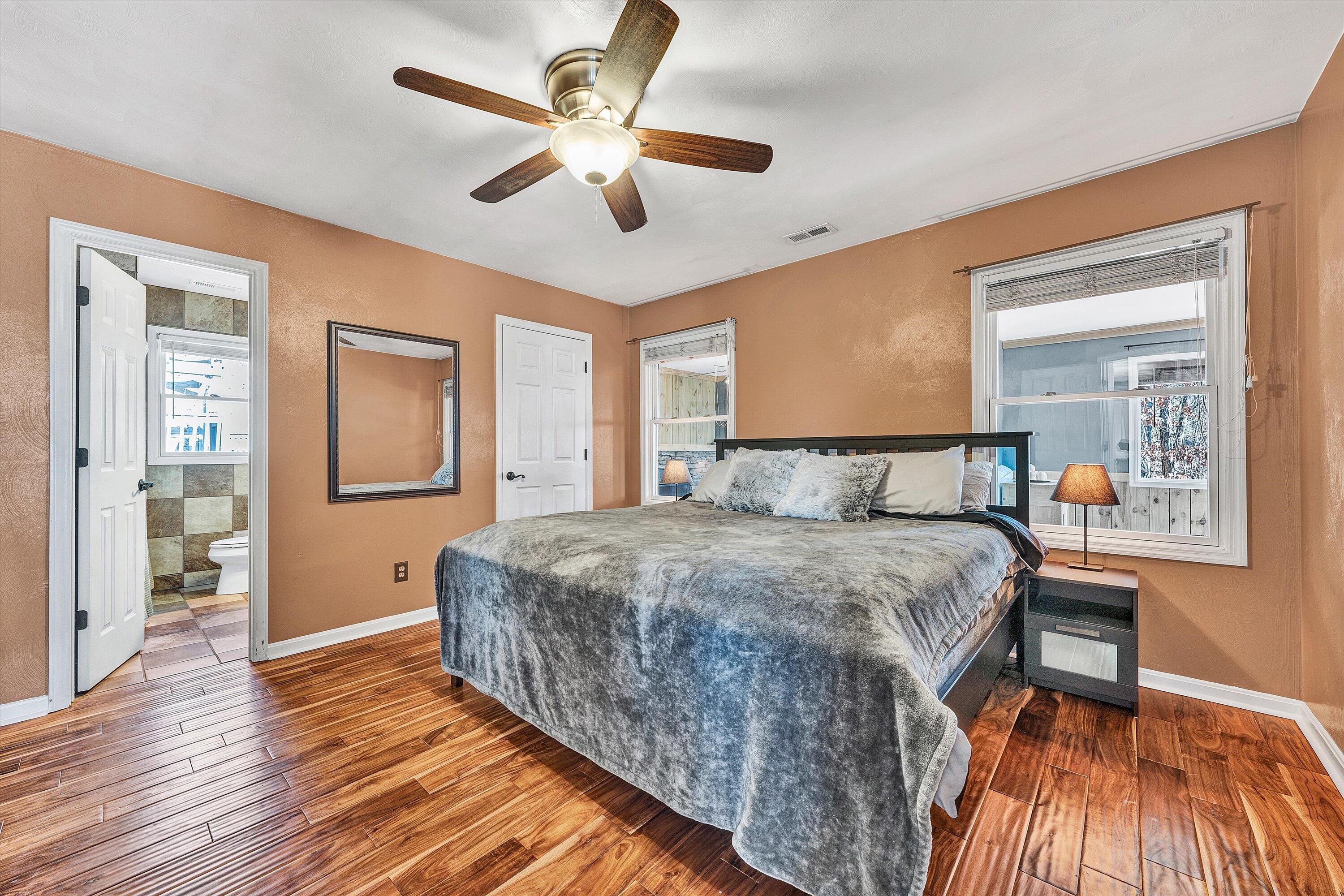 1311 Walnut Shell Drive Vinton, VA 24179 - Photo 24 of 61 a spacious bedroom with a bed and wooden floor