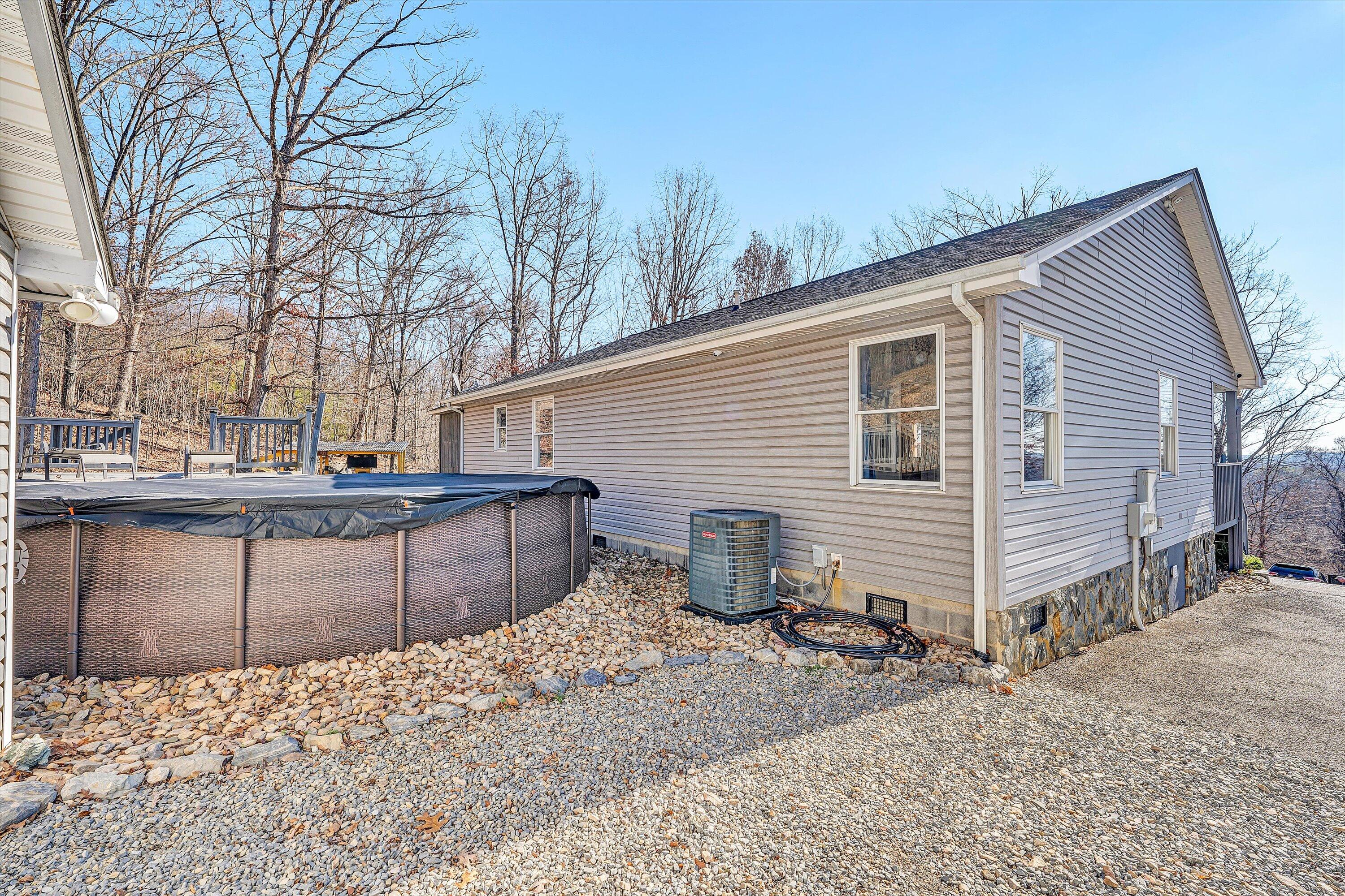 1311 Walnut Shell Drive Vinton, VA 24179 - Photo 42 of 61 a view of a backyard with snow on the road